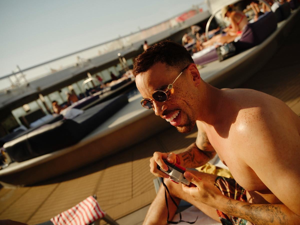 Solo traveler enjoying Virgin Voyages Aquatic Club pool | Virgin Voyages | Virgin Voyages solo travel